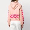Blusa casual de corte holgado con mangas desmontables en color rosa, tono blanco roto
