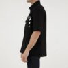 Camisa de pantalón corto de algodón estampada en color liso, negra