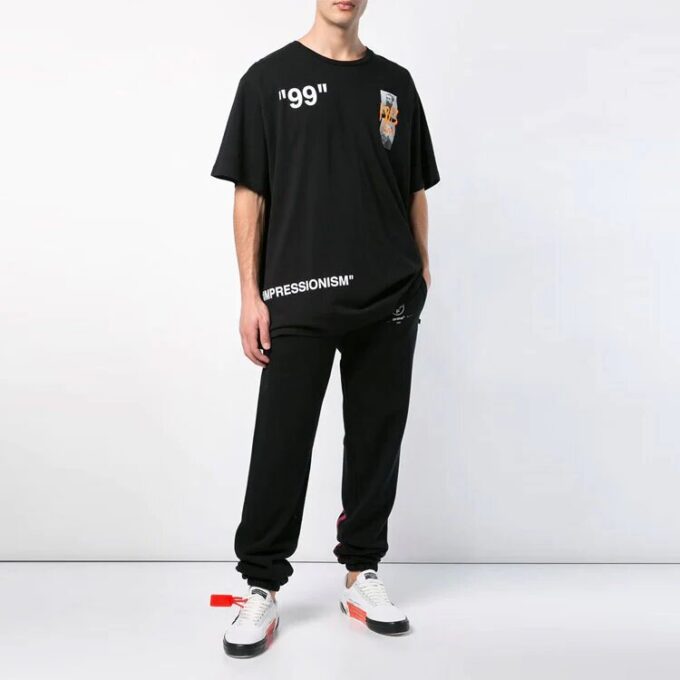 Camiseta de algodón de pantalones cortos holgada con estampado en negro
