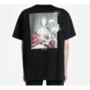 Camiseta de manga corta holgada con estampado en la espalda, color negro
