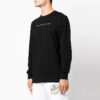Camiseta de manga larga con cuello redondo y estampado del logotipo de Cotton Arrow en negro