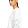 Camiseta de manga larga con diseño floral brillante en diagonal