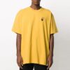 Camiseta holgada de manga corta con estampado de flechas, color amarillo