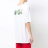 Camiseta oversize con cuello redondo, estampado y abertura trasera en color blanco roto