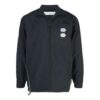 Chaqueta con cremallera, cuello alto y corte entallado, color liso, negra