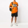 Estampado de flechas de graffiti, pantalones cortos, corte holgado, naranja