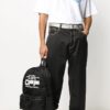 Mochila con logotipo ondulado y estampado de eslogan, negra