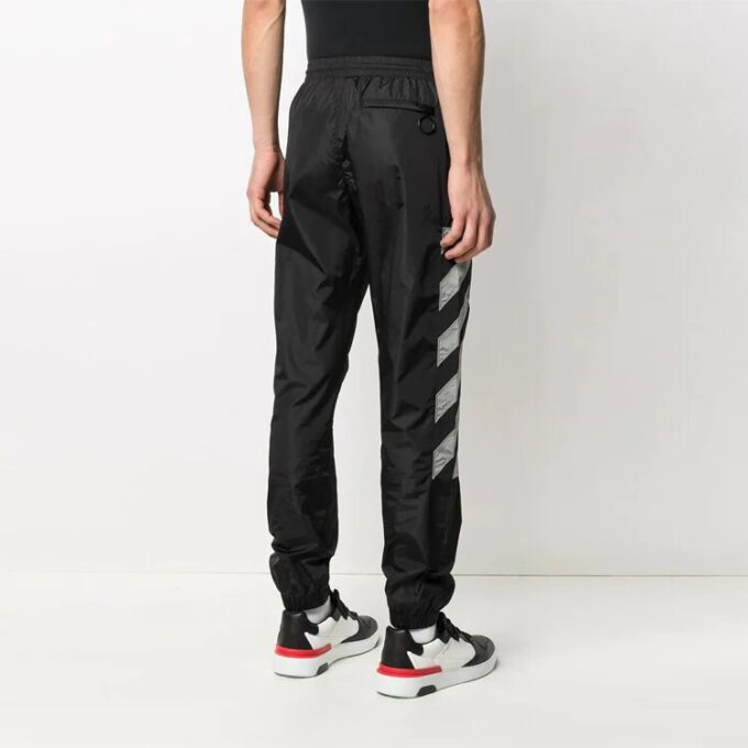 Pantalones deportivos con estampado de rayas laterales SS21, negros