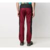Pantalones deportivos de calle Rubber Arrow, negros y rojos