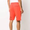 Pantalones deportivos para hombre FW20 con flechas pintadas en naranja