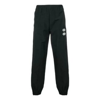 Pantalones informales de hombre Off-White de color liso con raya lateral blanca, negros
