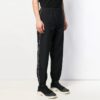 Pantalones informales de hombre Off-White de color liso con raya lateral blanca, negros