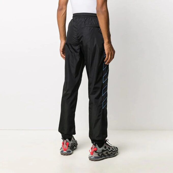 Pantalones largos de entrenamiento de nailon a rayas, negros