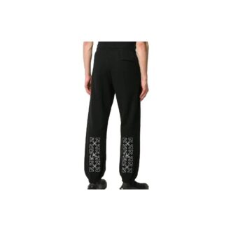 Pantalones largos deportivos con estampado de flechas, negros