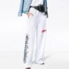 Pantalones largos unisex con grafitis, blancos